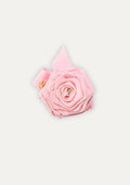 Handmade light pink fabric rose hair clip for girls, featuring a small crystal in the center and a gold COCETE brand charm.