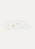 Handmade white triple fabric rose hair clip for girls, featuring crystal centers and a small gold COCETE brand charm.