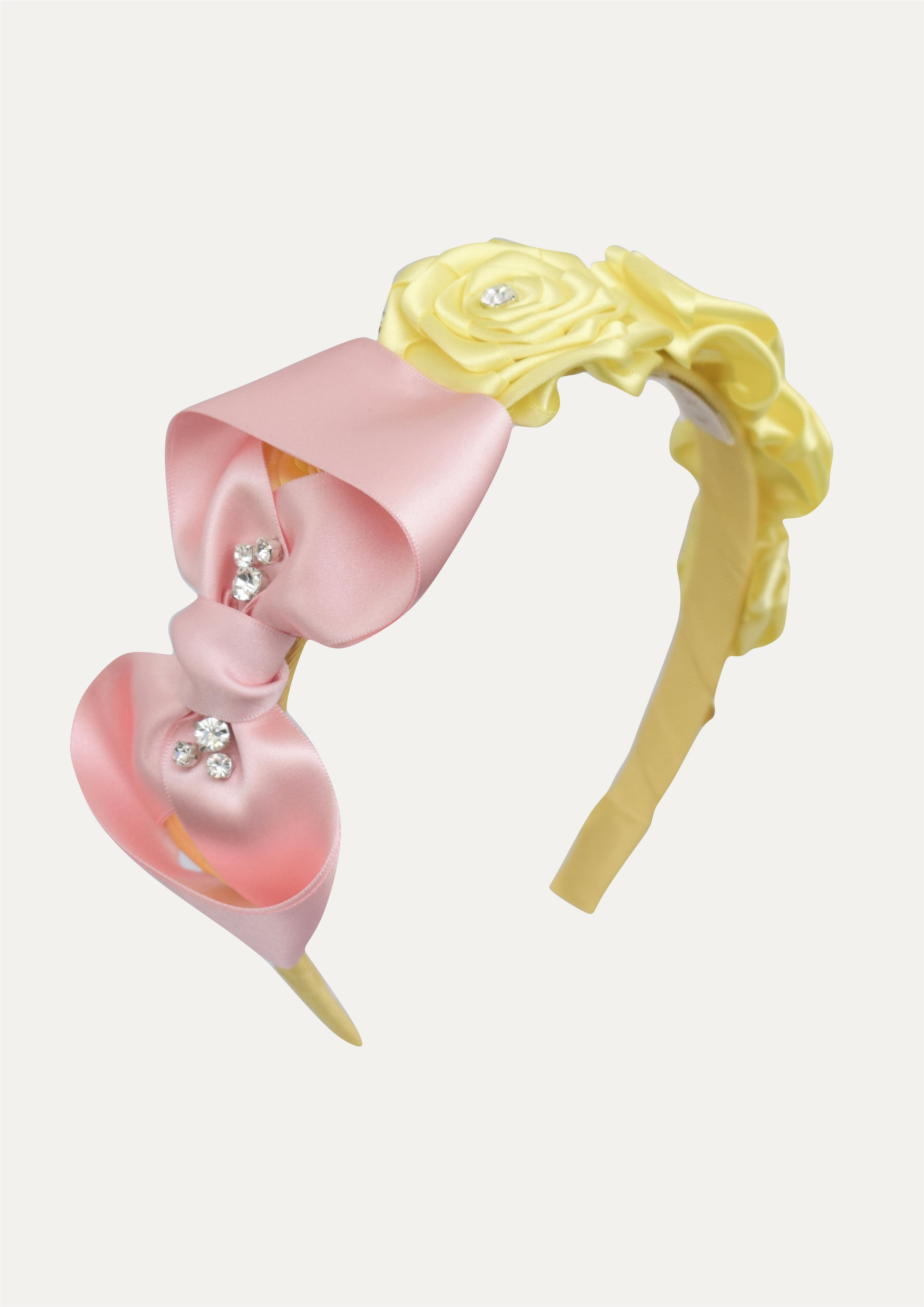 A beautiful combination of a soft pink satin bow and sunny yellow roses.