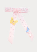 Handmade soft pink velvet hair bow with long tails, decorated with white pearls and two crystal-accented butterflies (yellow and blue), featuring a gold COCETE charm.