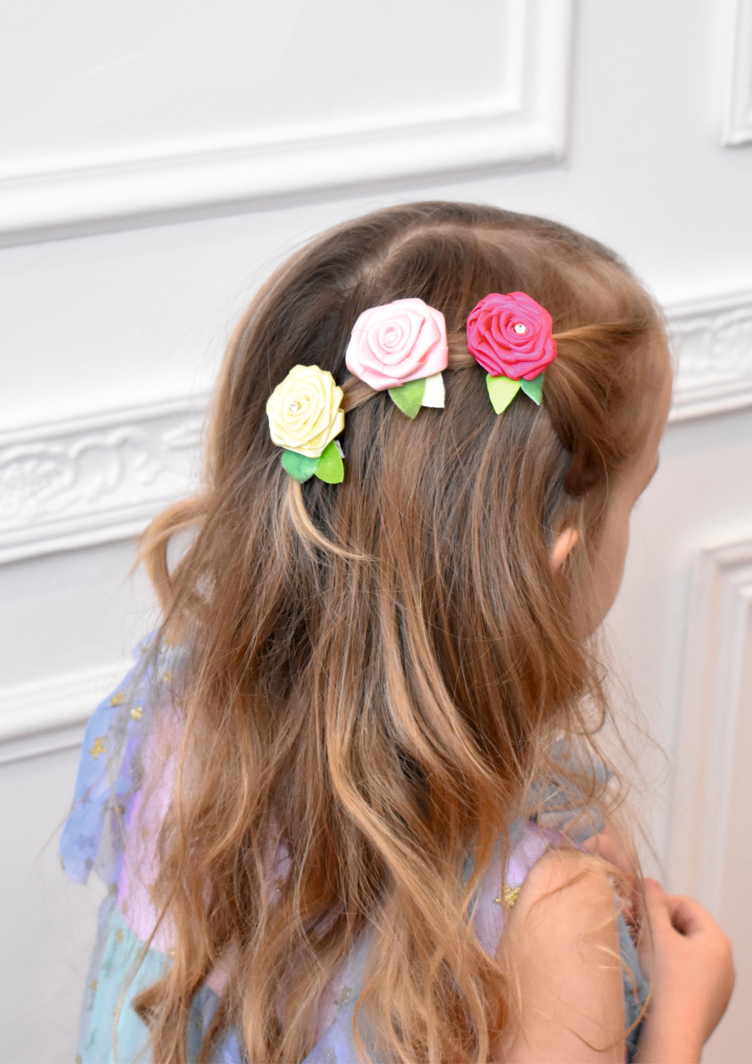 Handmade rose clip on a white background.
